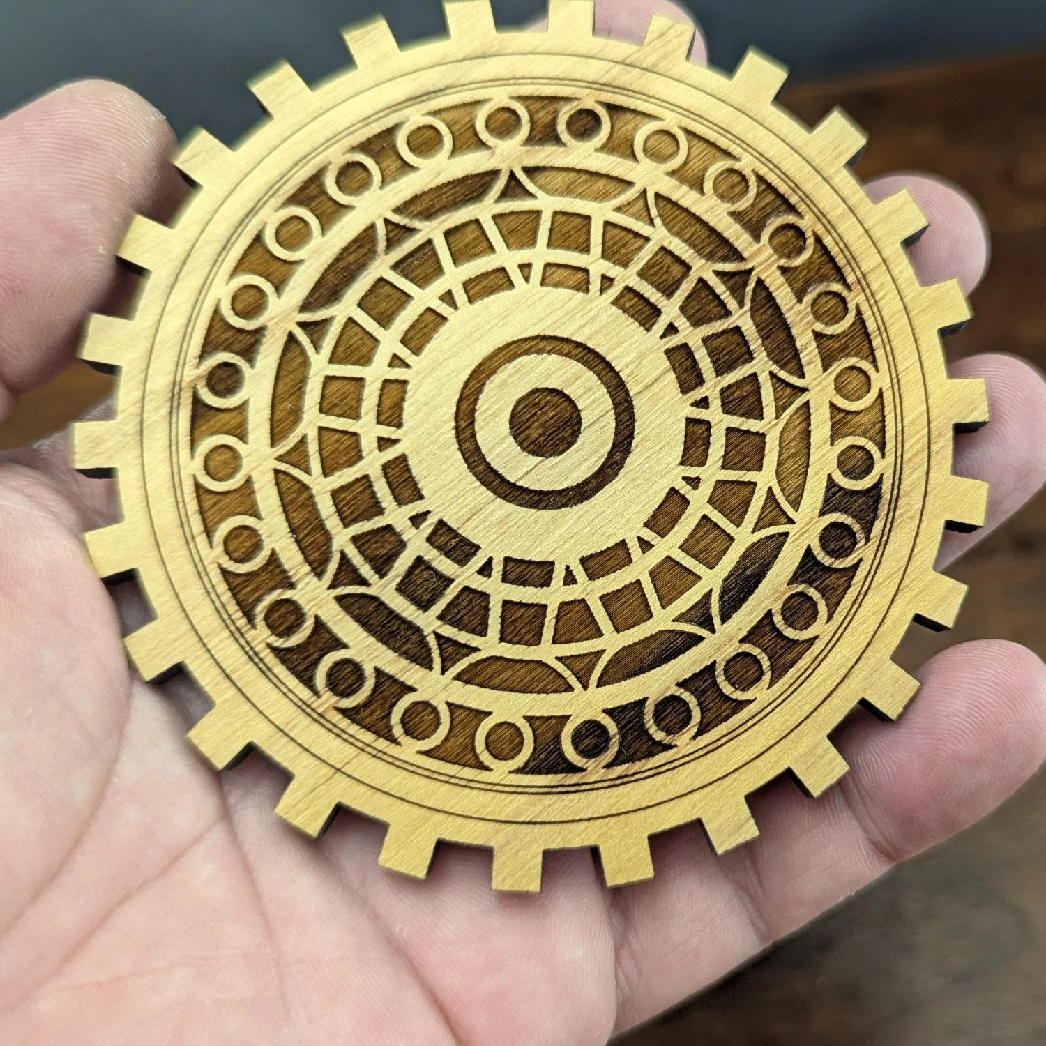 The Draftsman gear coaster with deep engraved pattern