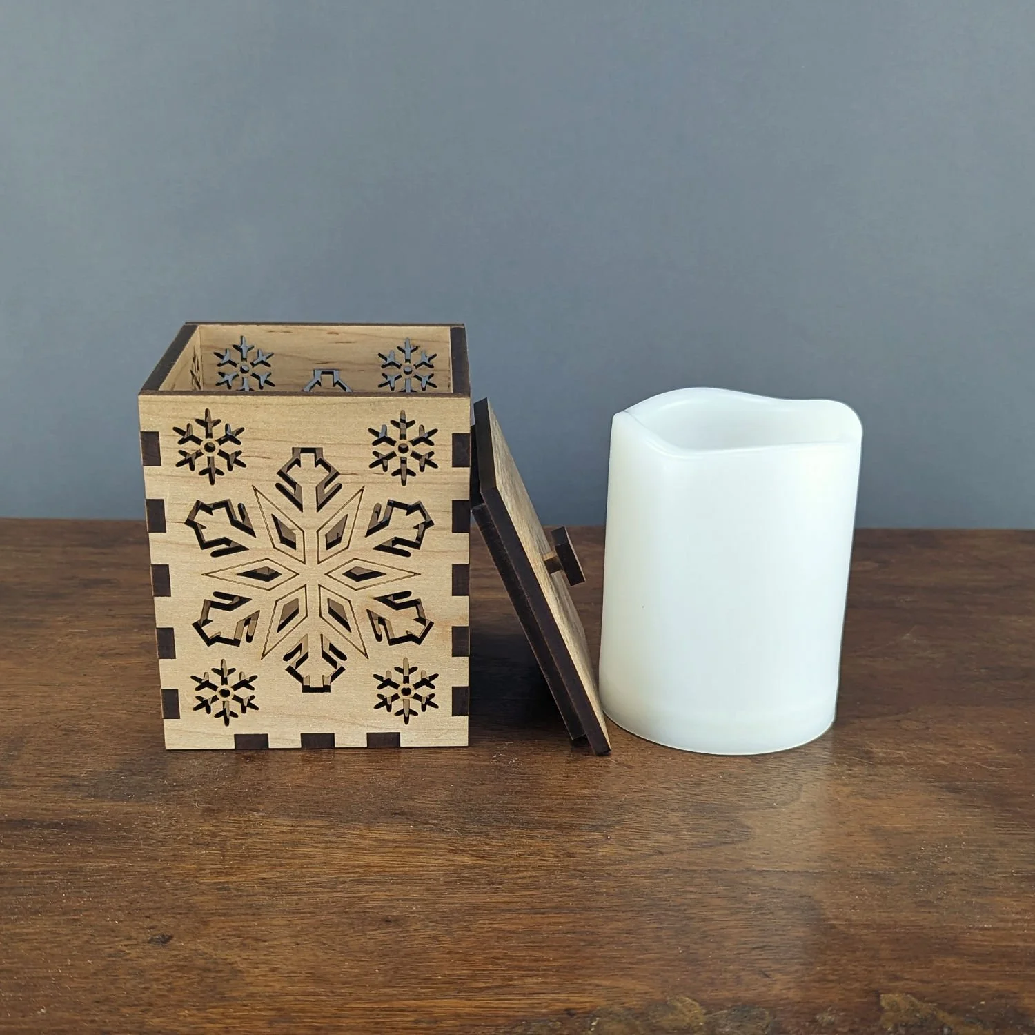 Maple Snowflake Lantern beside a 3x4 LED candle for size reference.