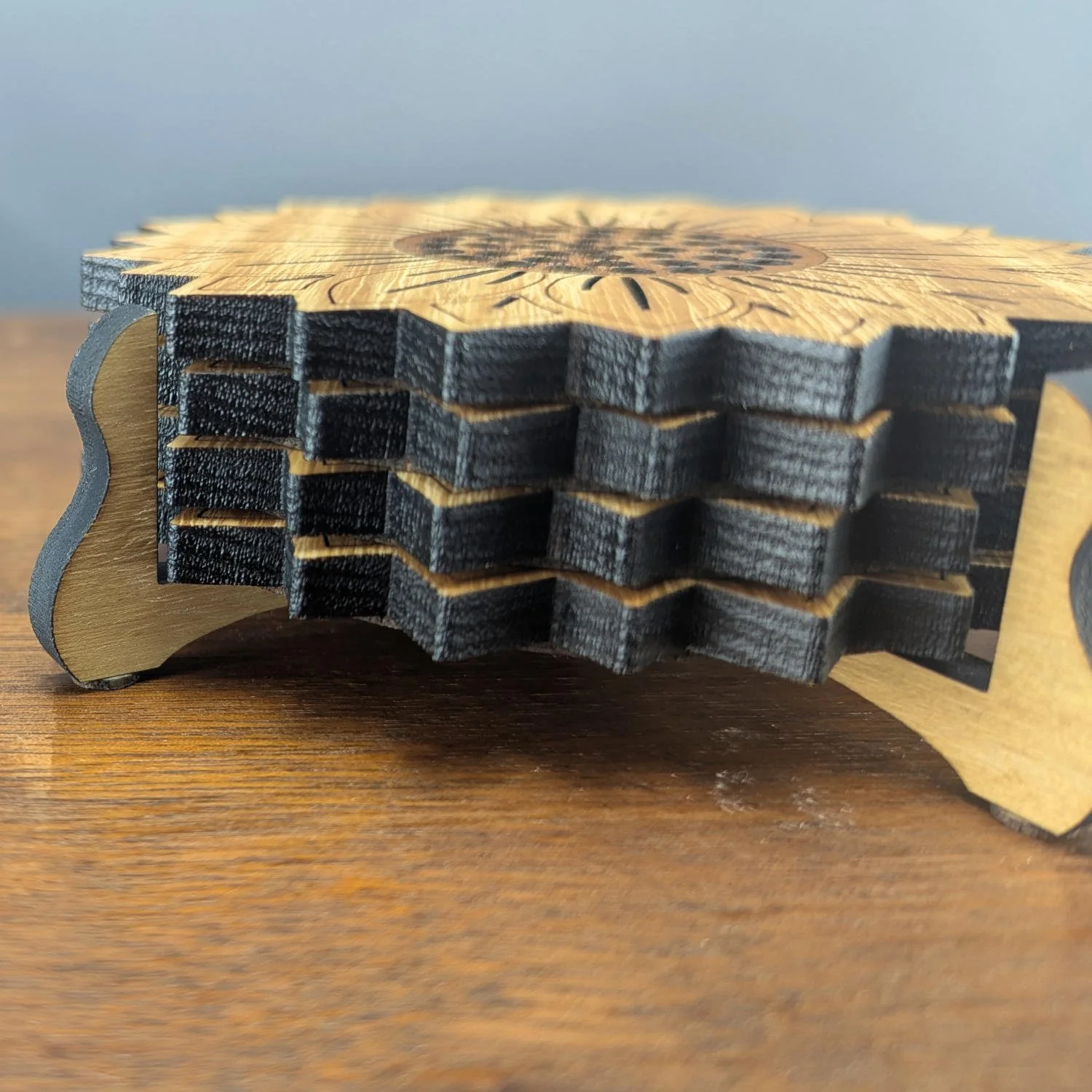 Close-up of sunflower coasters in coaster holder