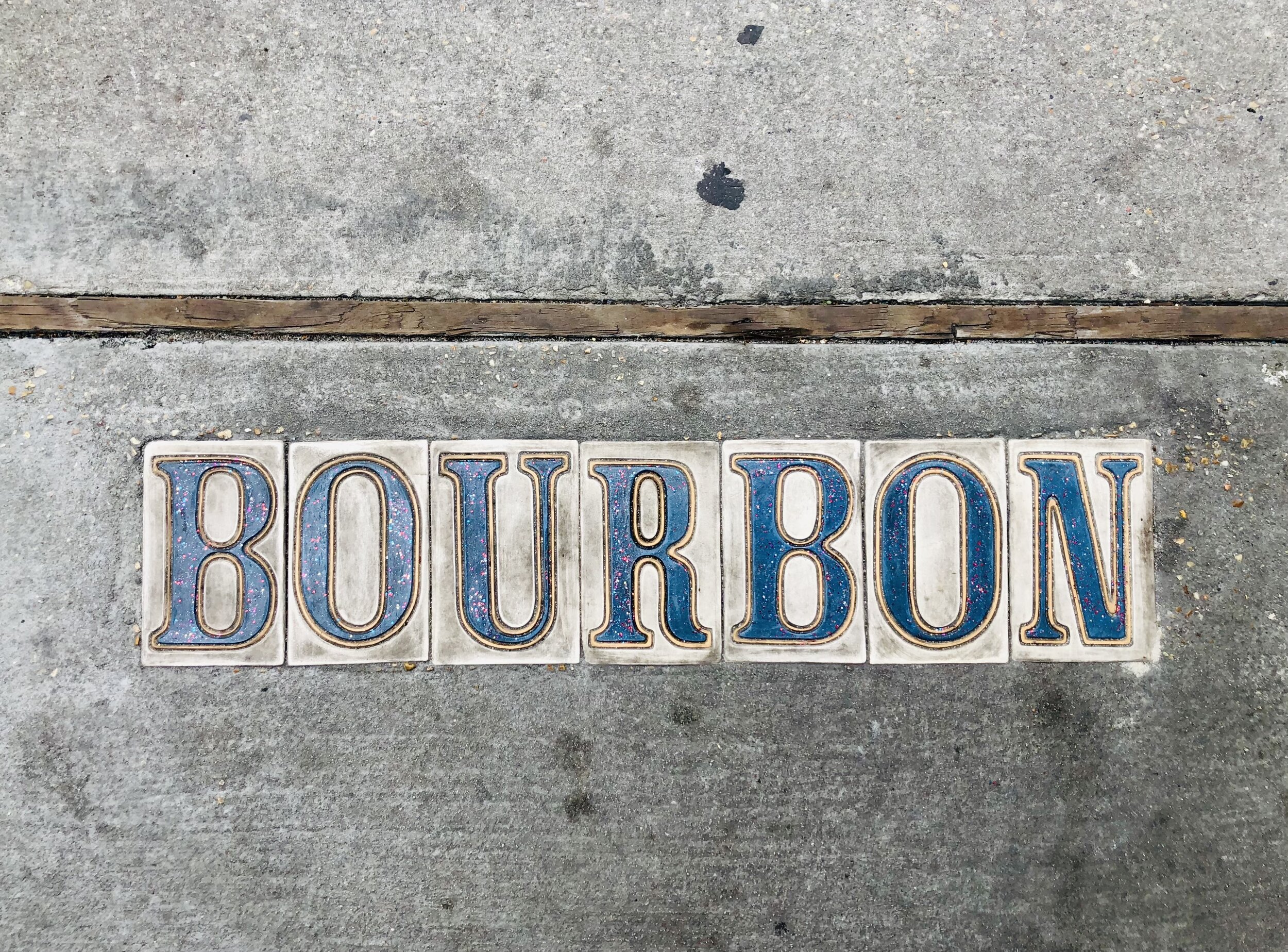 bourbon-street-sign-on-sidewalk-on-bourbon-street--DT6T3T4.jpg