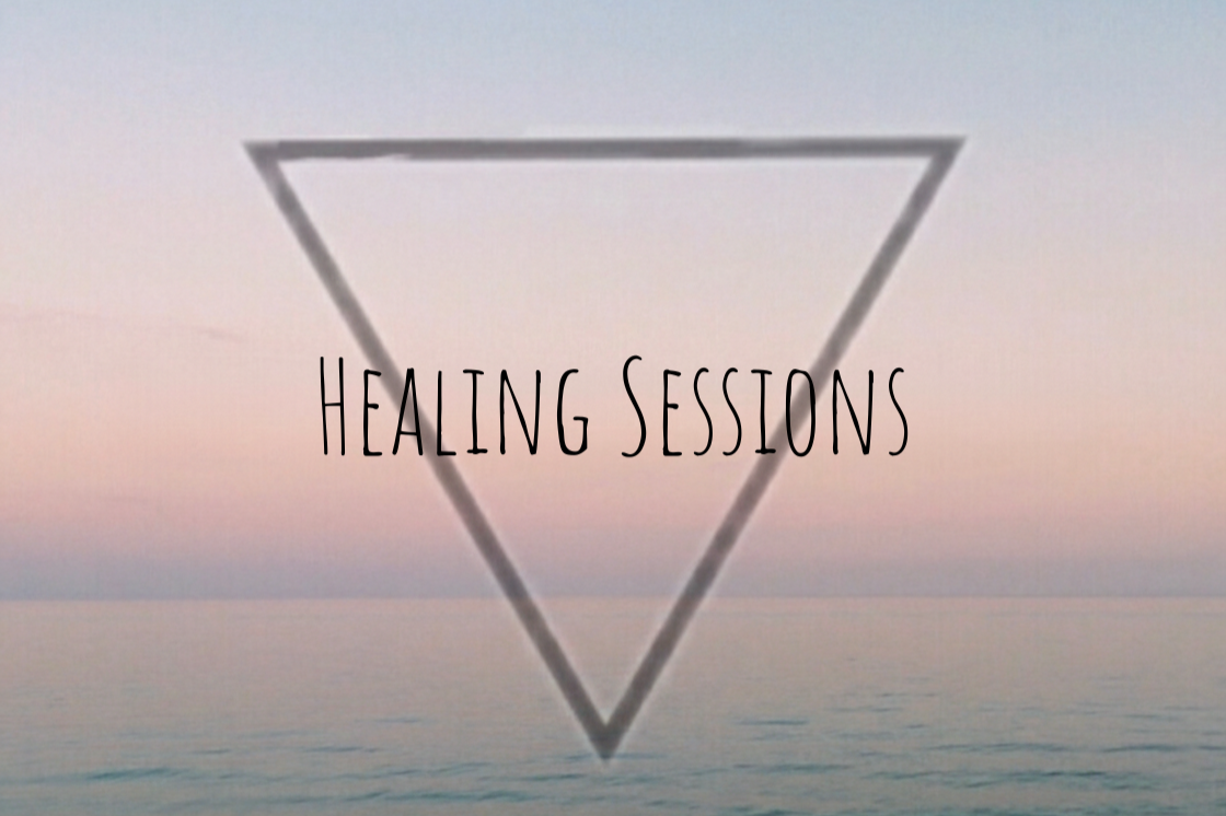 A pastel-colored sky over the ocean with a black upside-down triangle outline and the words 'Healing Sessions' in the center.
