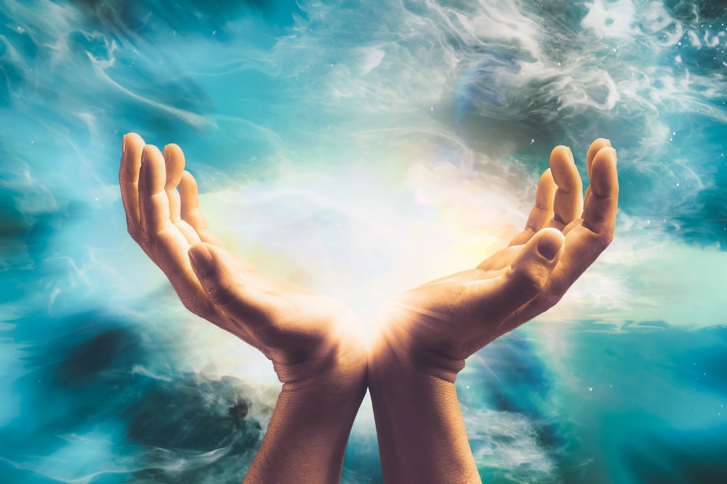 Hands cupped together with a glowing light in the center, surrounded by swirling blue and white clouds or smoke.