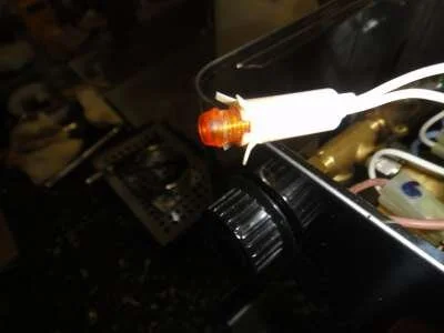 Then you stick the orange cover back into the fitting so you don't lose it! Removing the steam valve shaft is next.