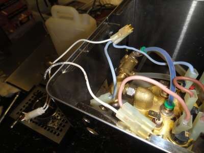 Now it's time to remove the electrical connectors from the element posts and the solenoid coil. When re-assembling, remember that the brown wire goes to the outside coil connector.