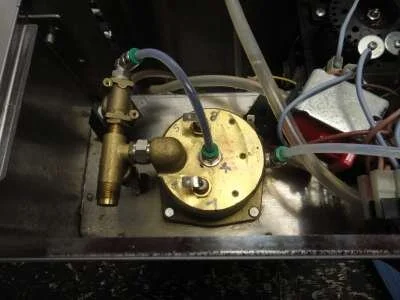 Finally, remove the earth wire from its spade connector and the boiler is free of all electrical connections. Plumbing connections are the next step.