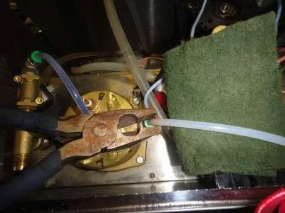 Removing the teflon pipes from the quick release connectors is a matter of pressing down the green plastic surrounds (using the tip of the pliers) while grasping the hose with the scotchbrite and pulling it up and out. You put them back the same way, press and push in hard.&nbsp;&nbsp;