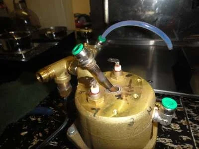 Then the fitting in the middle of the boiler (and usually the pipe that goes with it) can be unscrewed using the 11mm spanner.&nbsp; THIS MUST BE DONE BEFORE UNSCREWING THE BOILER BOLTS!
