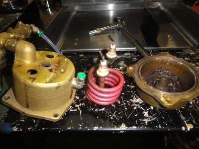 Undo the element post nuts with the 12mm spanner and remove the dead element, throw away the old boiler gasket and get ready to clean.