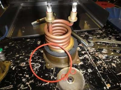 Here we have the standard element kit: element, o-rings, boiler o-ring. We've added a new group gasket to the base.