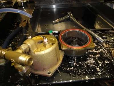 Tighten up the nuts, then pop the new boiler gasket into the slot in the base.