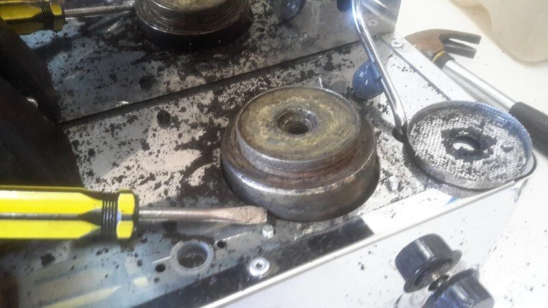 After channeling our inner Michelangelo, eventually most of the heavy build up is gone.&nbsp;  The only practical way to clean the showerscreen is to burn the crud out over a gas flame, so it's sent off for that (a good ventilation or an extractor fan is needed to get rid of the smoke)