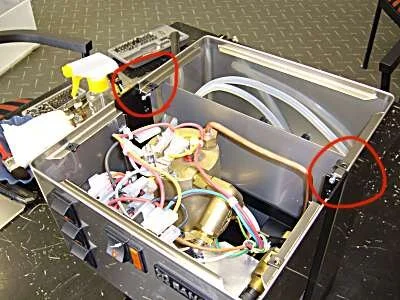 Undo the 2 small screws (fine pointed phillips head screwdriver needed.)