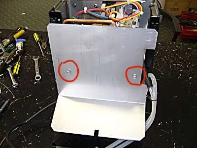 Undo the 2 screws and washers ( DO NOT LOSE THE WASHERS ) and remove the interior panel.