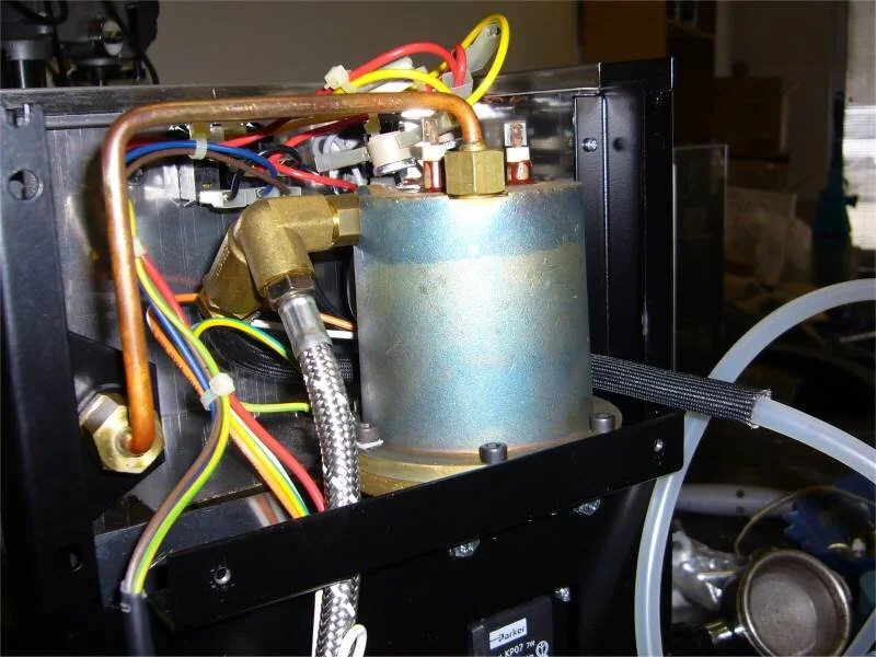 In machines purchased after 2006, the boiler, pump to boiler hose and boiler to steam valve pipe look like this. Except not so obviously blued by overheating. Replacement boilers are now all this model.