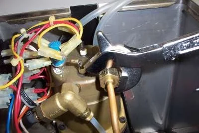 Then undo the steam pipe nut (18mm) where it attaches to the boiler.