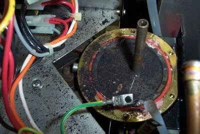 In a sink or tray, knock the boiler loose with a sharp tap with a hammer, then pull it straight up.  Clean up the base, remove and discard the old o-ring, insert a new o-ring in the groove.  Note that all the crap in the base is a consequence of boiler overheating.