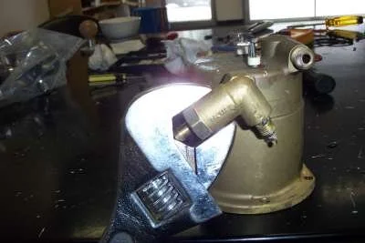 Remove the overpressure valve (OPV) hose from the old boiler&nbsp;( don't lose the spring clip ).  Give the bolt ( left hand )&nbsp;end of the valve ( NOT the barb ) a sharp downwards tap with&nbsp;the hammer, then unscrew the OPV.&nbsp;