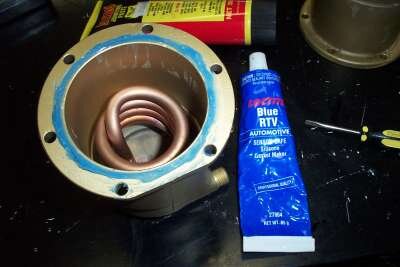 Before reassembling I run a bead of high temperature silicone gasket sealant around the edge of the boiler as "insurance" against leaks.  Attach the OPV hose before putting the boiler back into the machine.