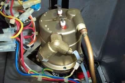 Finally, I trim 5mm off the end of the teflon pipe before pushing it back onto the nipple (you can only do it once), then reassemble everything in the order I removed it.   Make sure all the boiler hex bolts are good and tight.