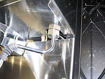 Undo the steam wand nut (18mm spanner) and remove the wand by pulling it down. The o-ring may be on the end.