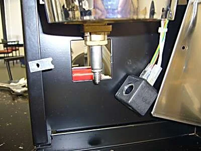 At this point the coil can be removed by simply pulling it down off the valve shaft.  If it needs replacement, it's a simple matter to pull the existing electrical wires off the old coil and attach them to the new one, one at a time.