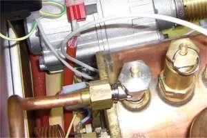 The vacuum breaker valve is the silvery one on the left.