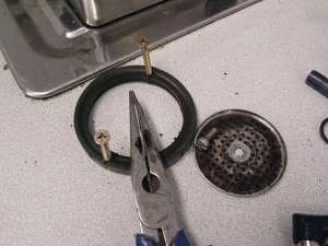Once the old gasket is out it's time to scrape, scrub and flush the groove before the new gasket goes in.