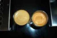 Shot with 13.5g of coffee, double basket  Note the differences in coffee volume and crema colour. The "warm" shot is on the right.