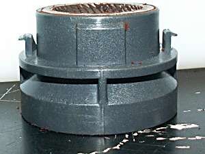 Top (stator) burr carrier, here displayed upside down to highlight the plastic "ears" which engage the threads in the adjustment collar.