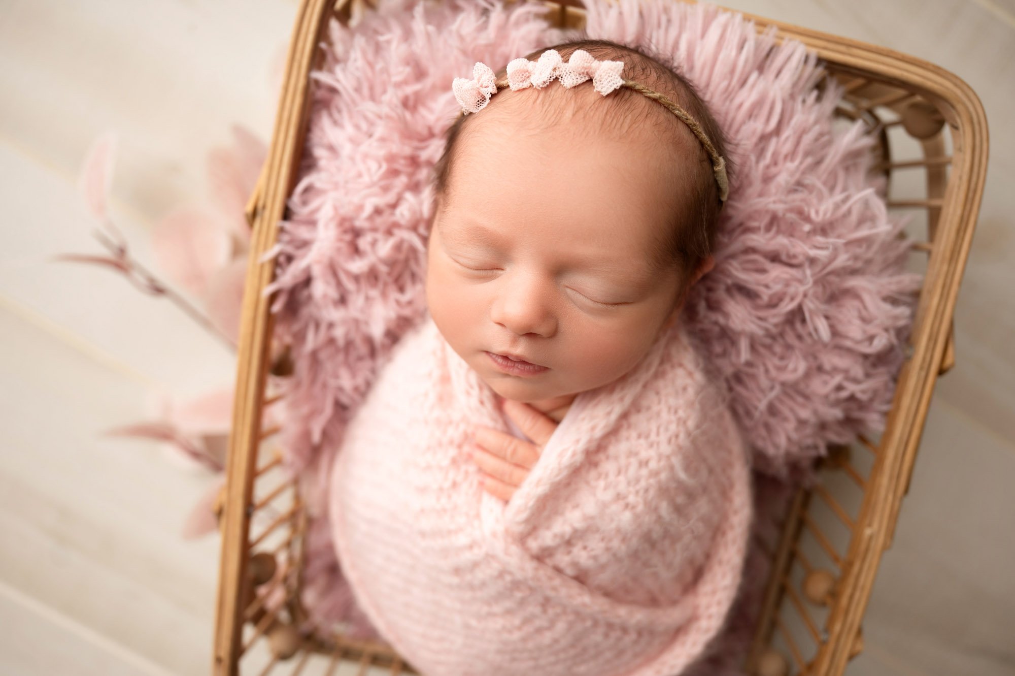 baby girl in all pink during newborn photoshoot