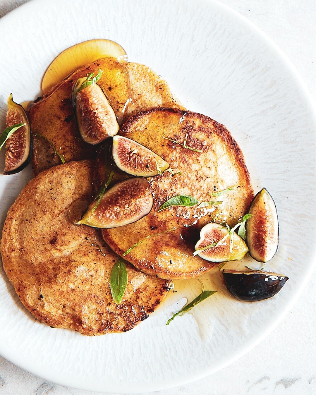 celebrating #fig season.⠀⠀⠀⠀⠀⠀⠀⠀⠀
Figs with lemon verbena and honey.  The trio works beautifully on its own or topped on practically anything... toast with ricotta, atop a pizza, on a pavlova...⠀⠀⠀⠀⠀⠀⠀⠀⠀
Here it's on sourdough starter pancakes (uh...