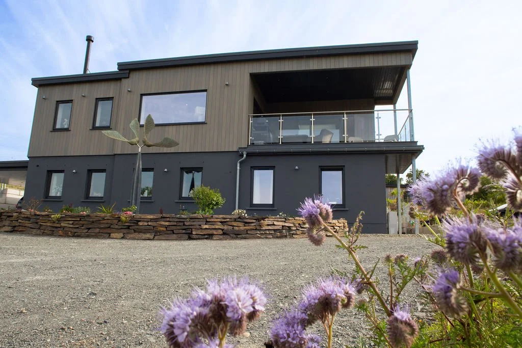 The Dunes - Modern square riverside holiday home with large drive way, covered balcony and car port on the side - The Dunes - Patch, Cardigan - Pembrokeshire Holiday Co