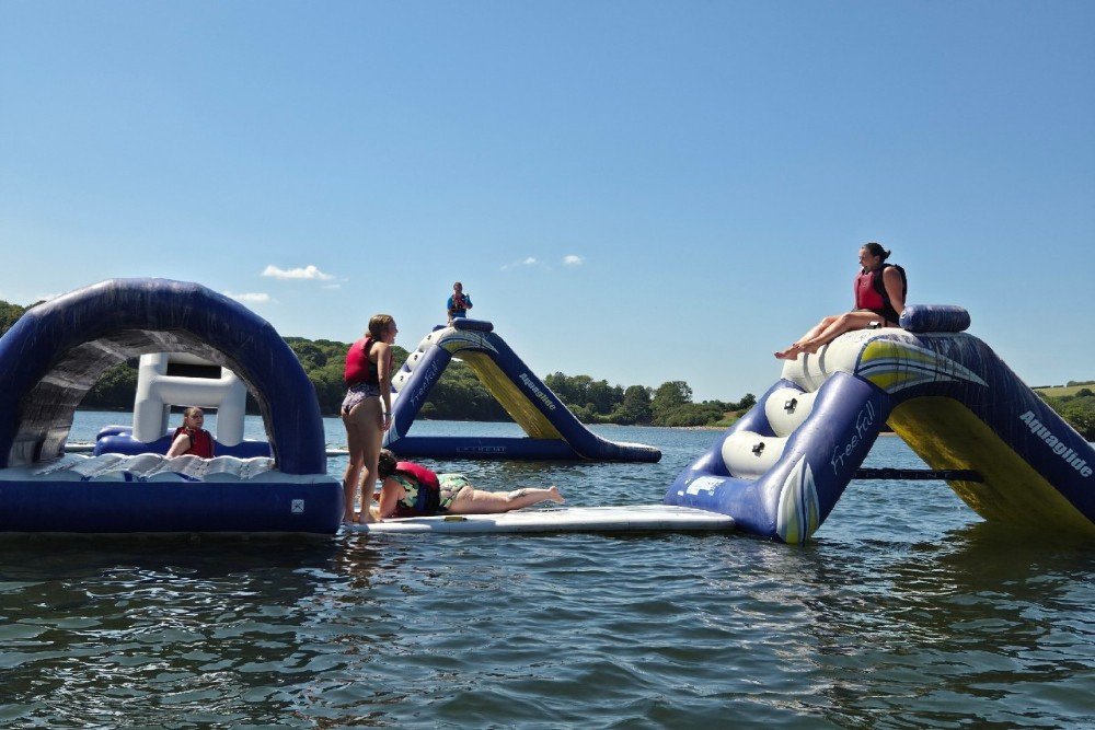 Children enjoying using the Aqua park at Llys y fran in Pembrokeshire