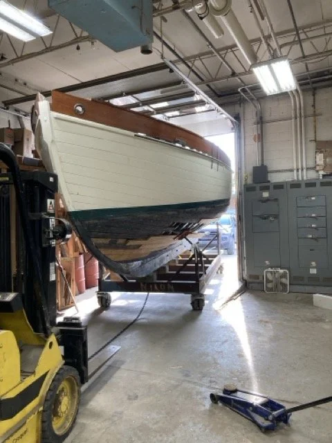 squeezing the boat into the shop