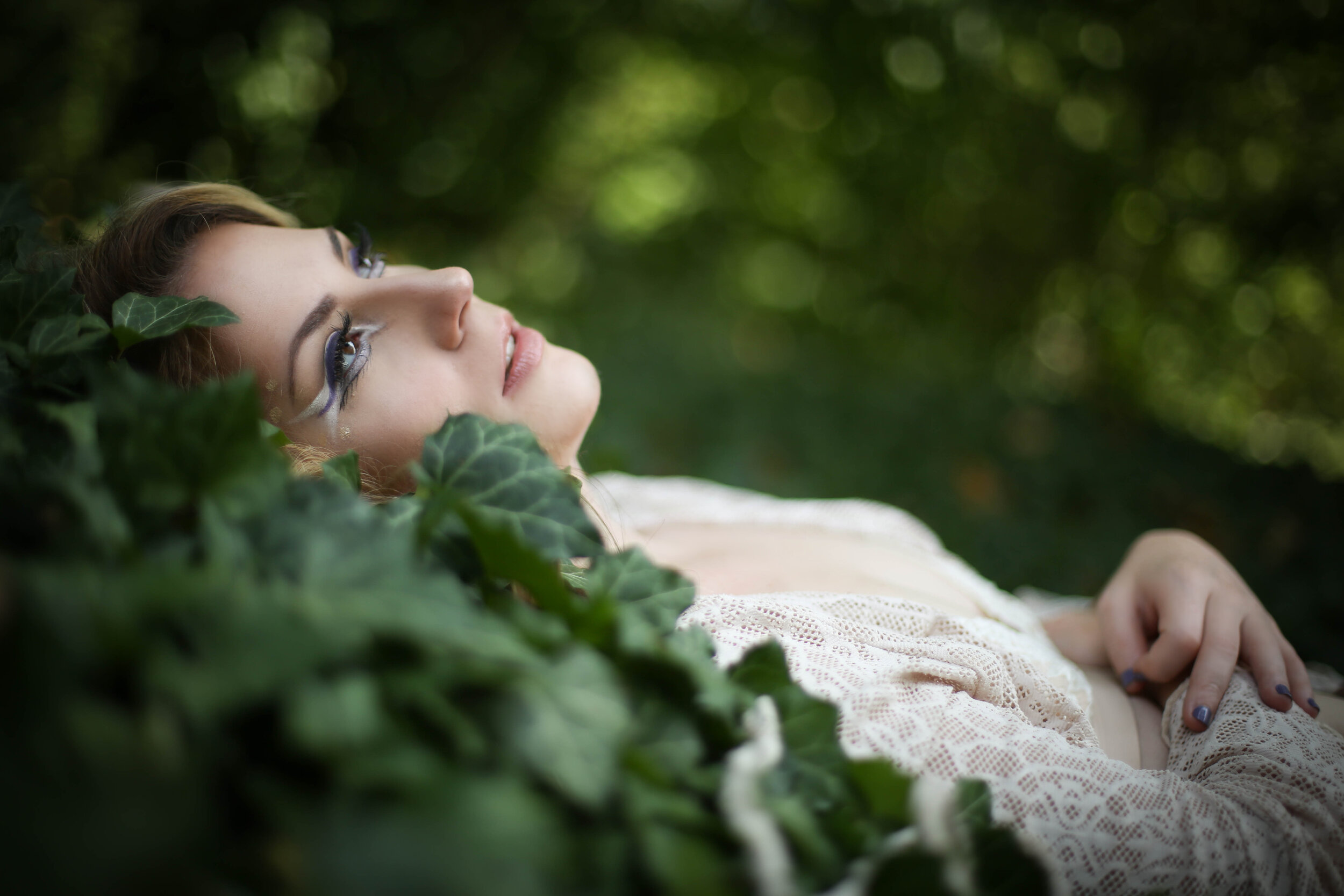 boston boudoir photographer Stephanie Olsen garden goddess woman in lingerie in forest garden ivy doe eye make up
