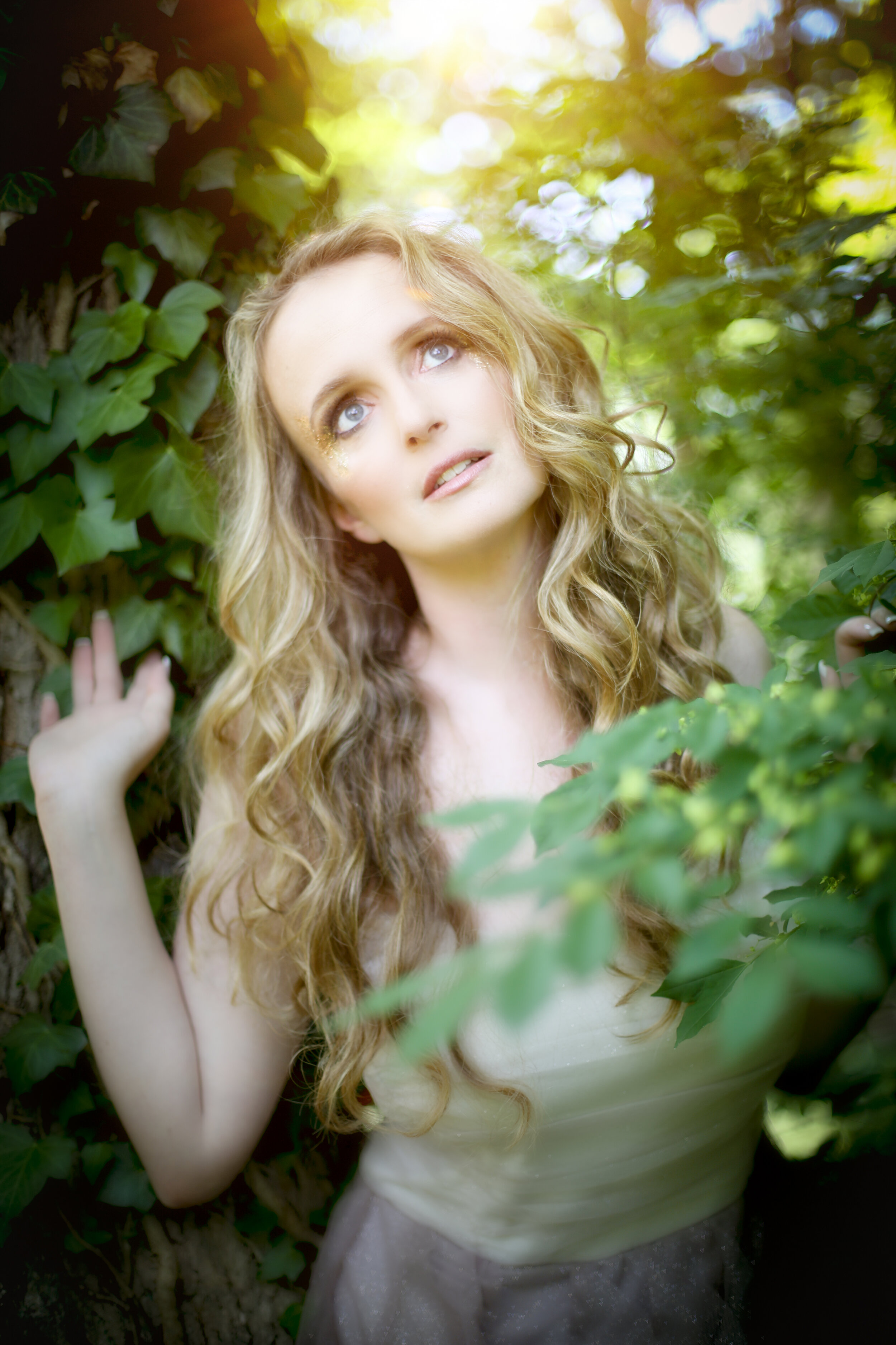 boston boudoir photographer Stephanie Olsen garden goddess sexy woman in lingerie in forest garden ivy sun flare