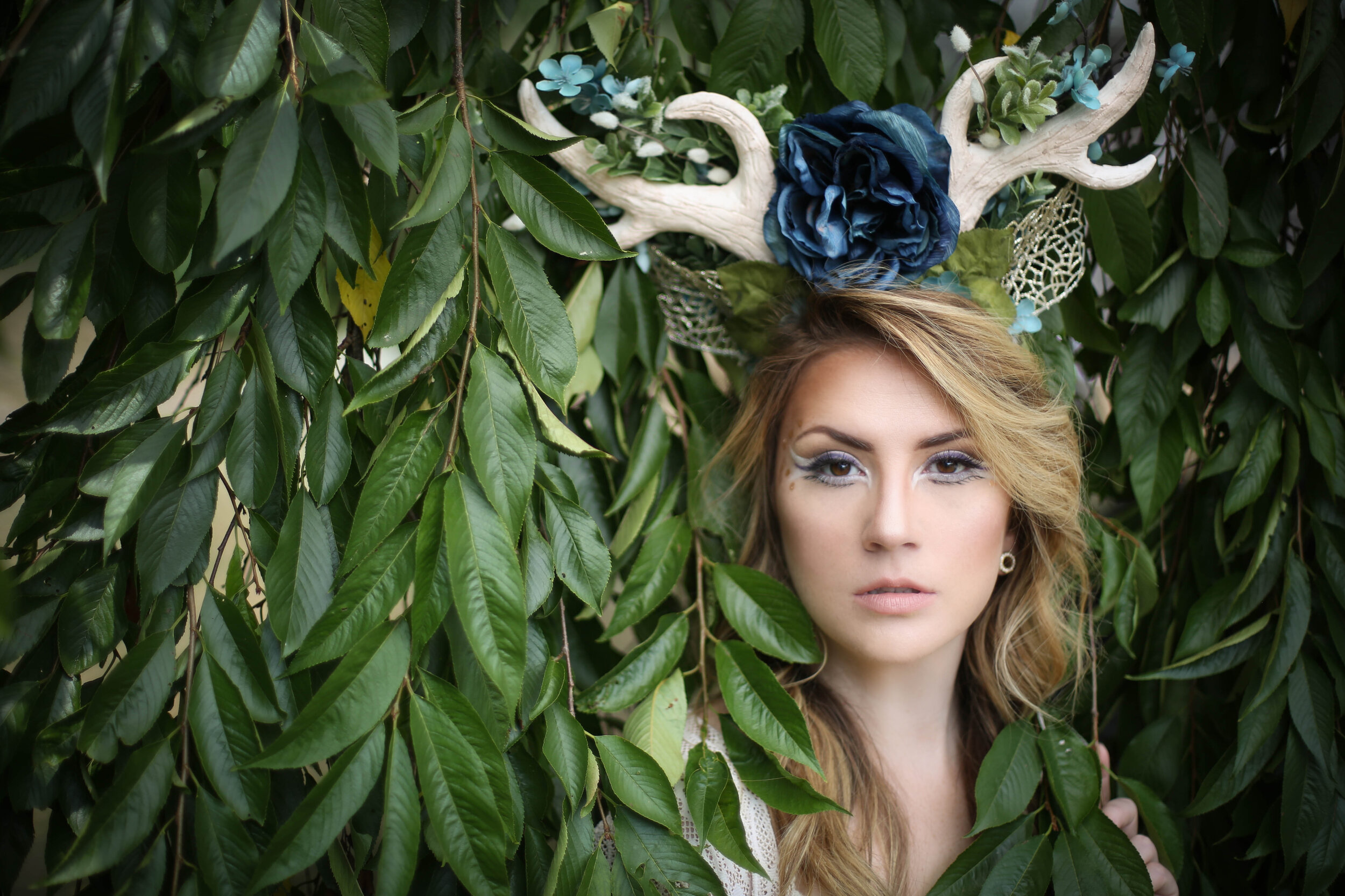 boston boudoir photographer Stephanie Olsen garden goddess woman in lingerie in forest garden ivy doe eye make up antlers