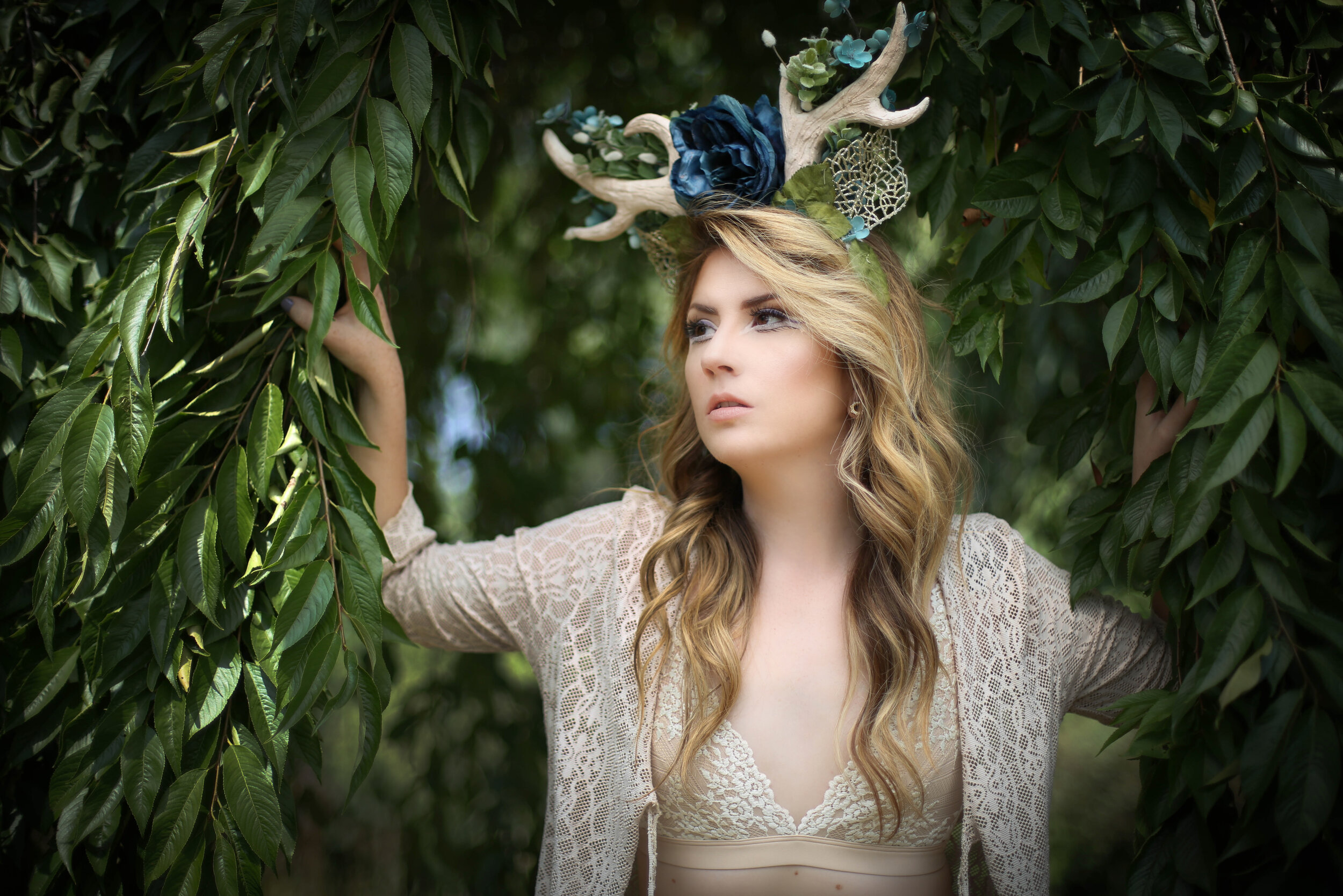 boston boudoir photographer Stephanie Olsen garden goddess woman in lingerie in forest garden ivy doe eye make up antlers