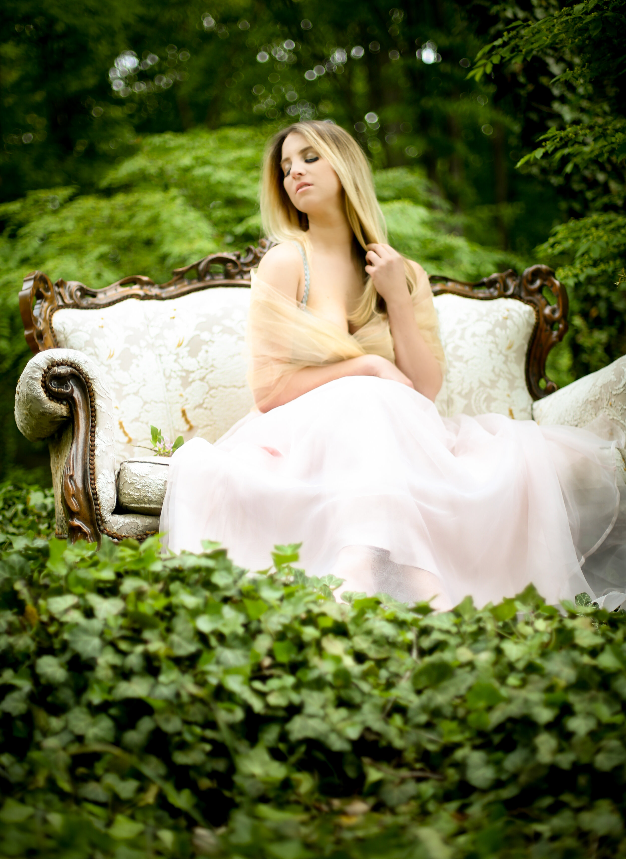 boston boudoir photographer Stephanie Olsen garden goddess sexy woman in lingerie in forest garden ivy vintage settee