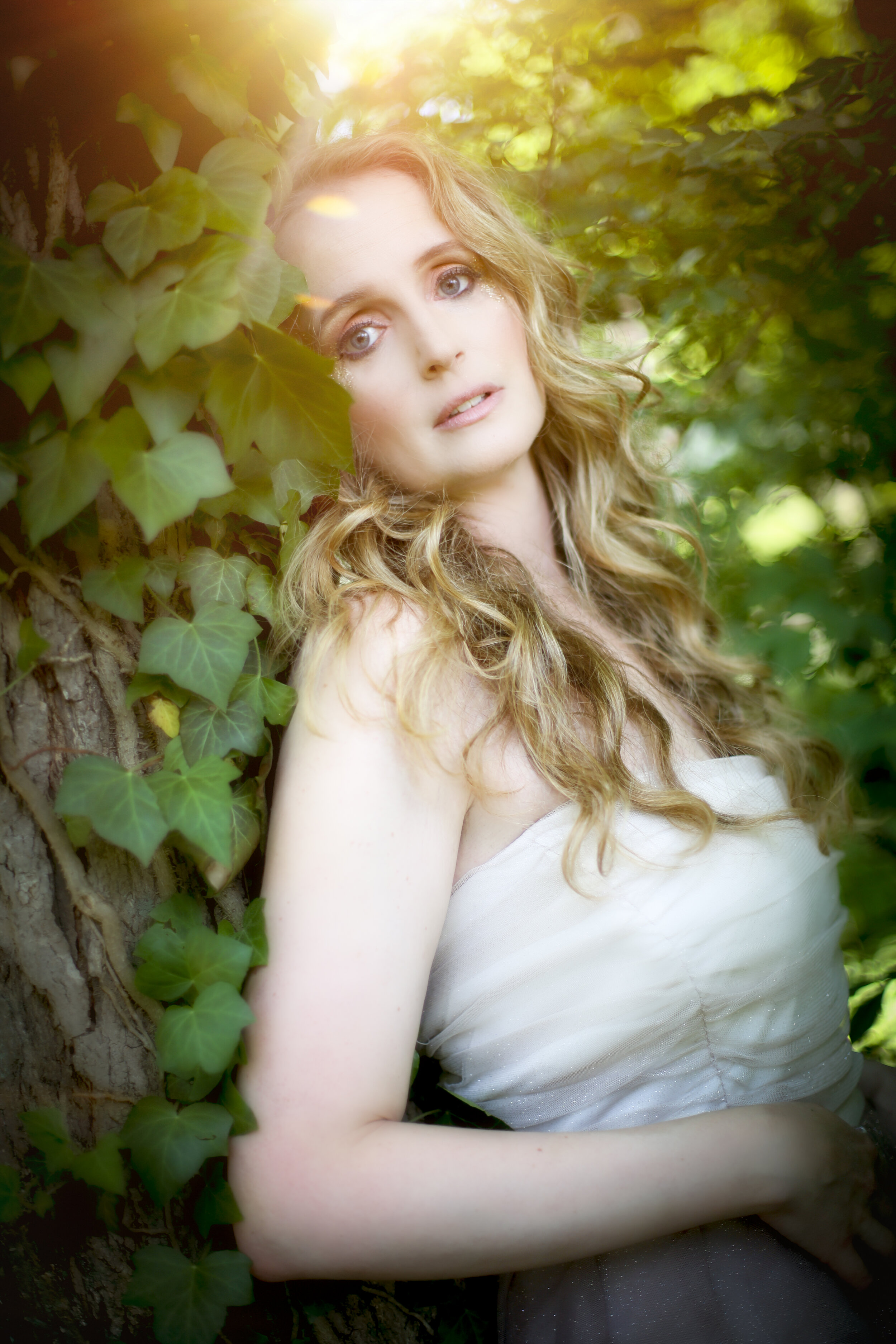 boston boudoir photographer Stephanie Olsen garden goddess sexy woman in lingerie in forest garden ivy sun flare