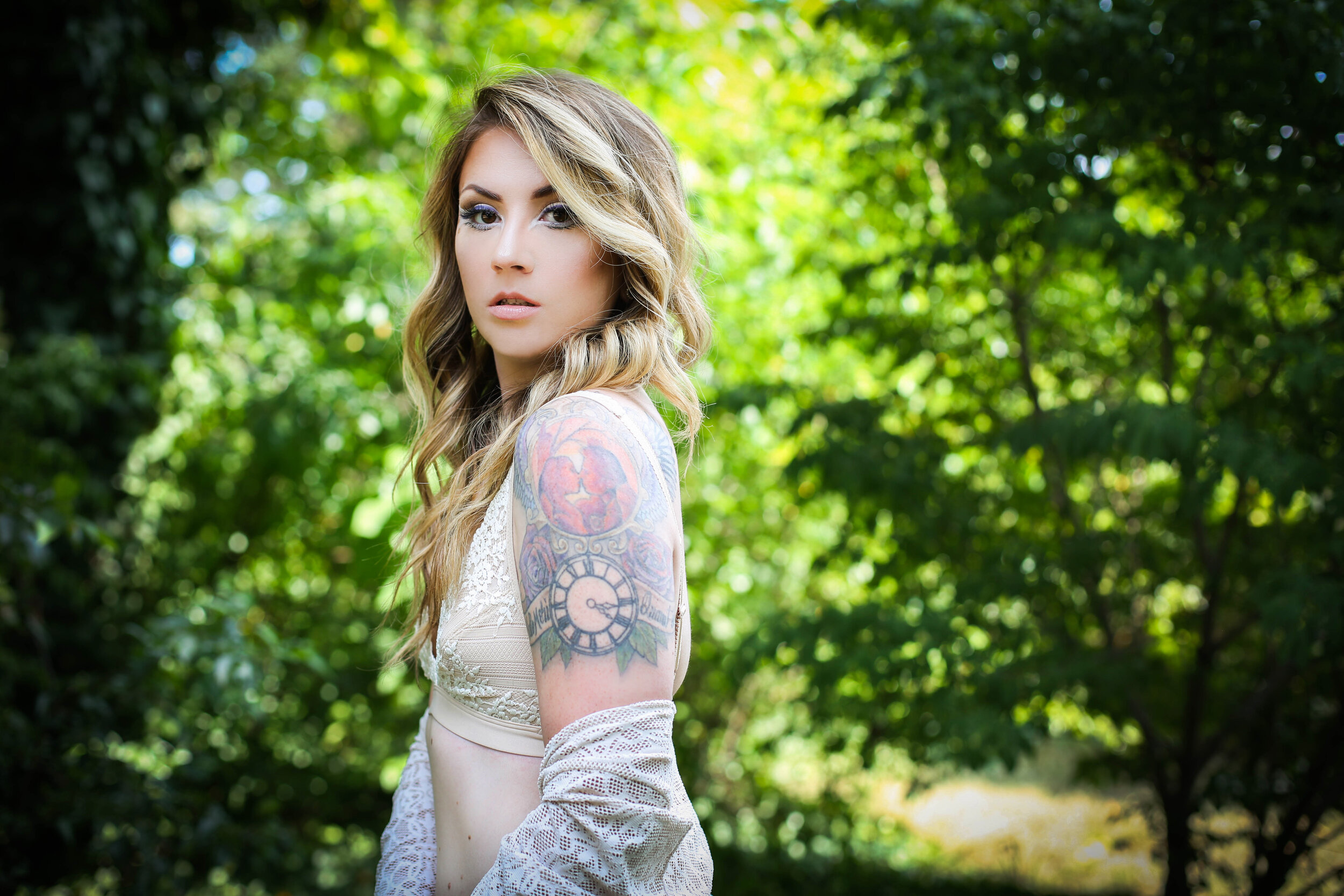 boston boudoir photographer Stephanie Olsen garden goddess woman in lingerie in forest garden ivy doe eye make up tattoo