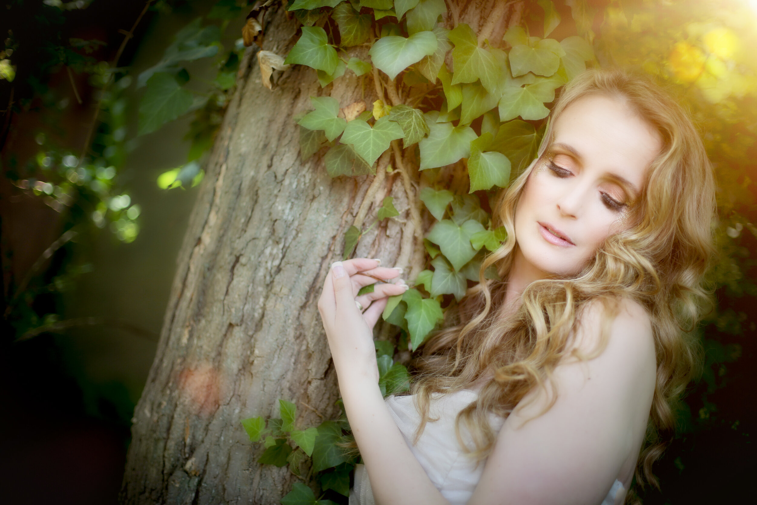 boston boudoir photographer Stephanie Olsen garden goddess sexy woman in lingerie in forest garden ivy sun flare