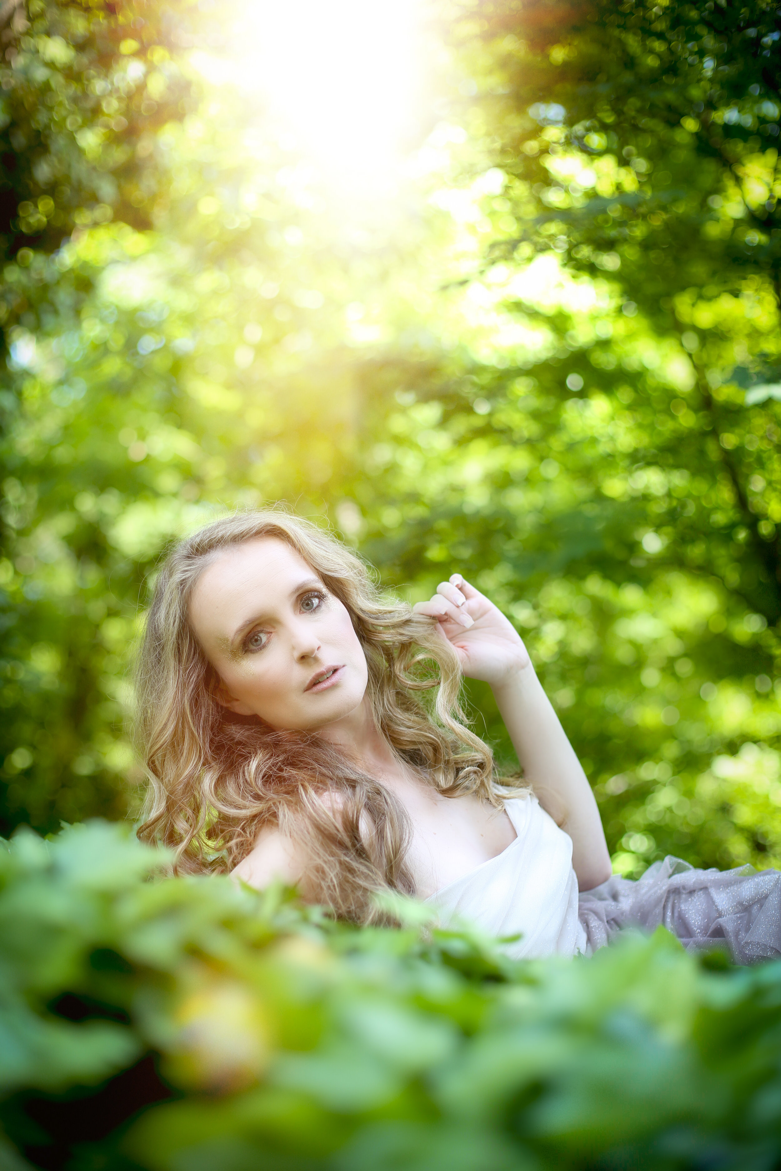 boston boudoir photographer Stephanie Olsen garden goddess sexy woman in lingerie in forest garden ivy sun flare