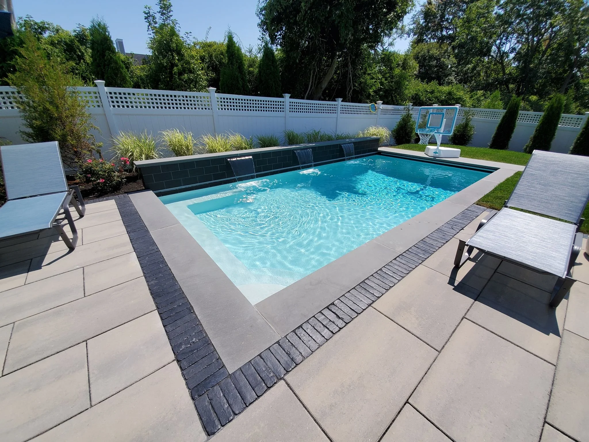 Here’s How a Unilock Authorized Contractor Constructs a Resort Style Pool and Patio in the Newport, RI, Area