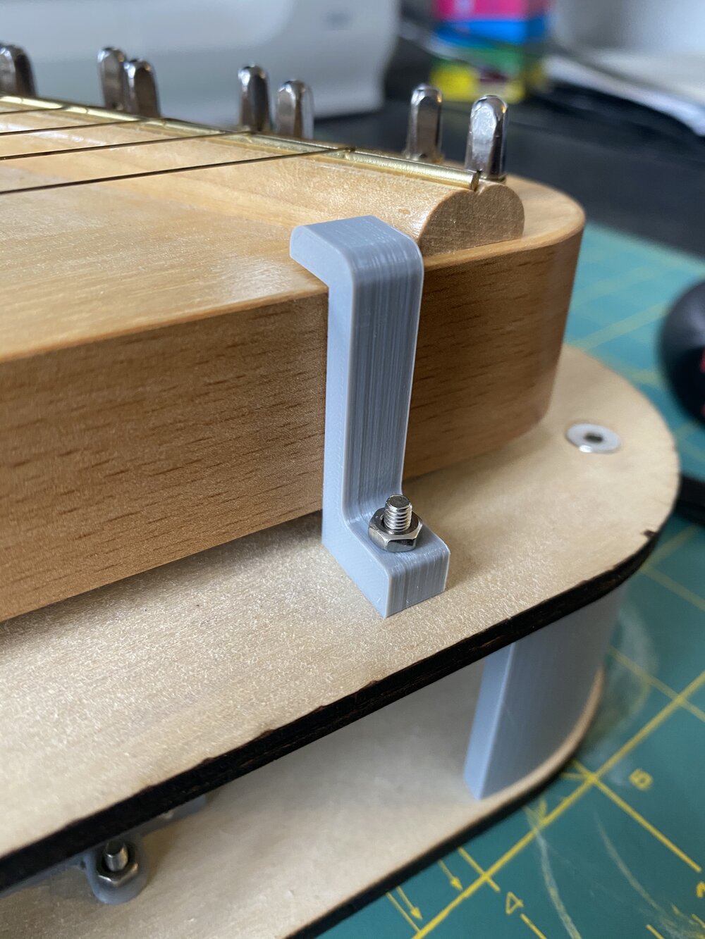 3D printed clip to hold down lap harp in robotic instrument