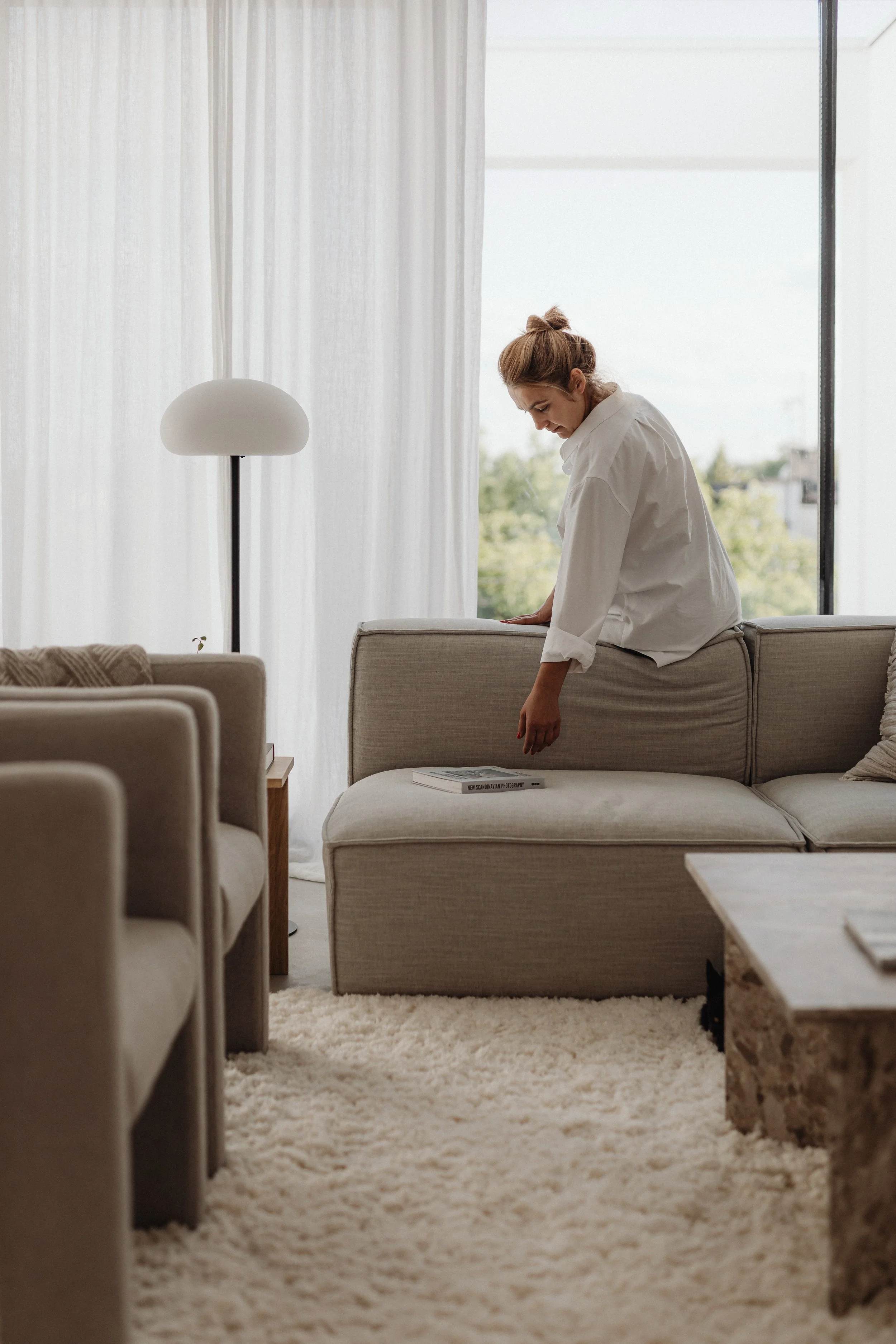 A woman in a white shirt.Katie McFarlan Dakota Design Company Best Client Process Templates for Interior Designers