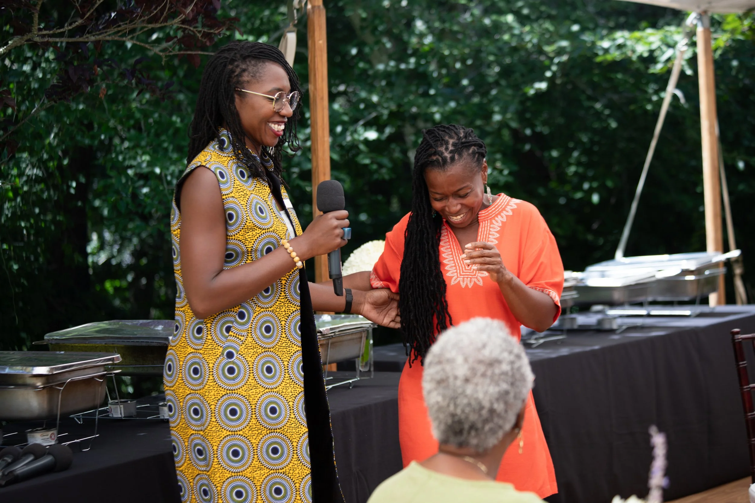M4BL Co Executive Director Dr. Amara Enyia and Monifa Bandele share a laugh at the M4BL x CBCF event 