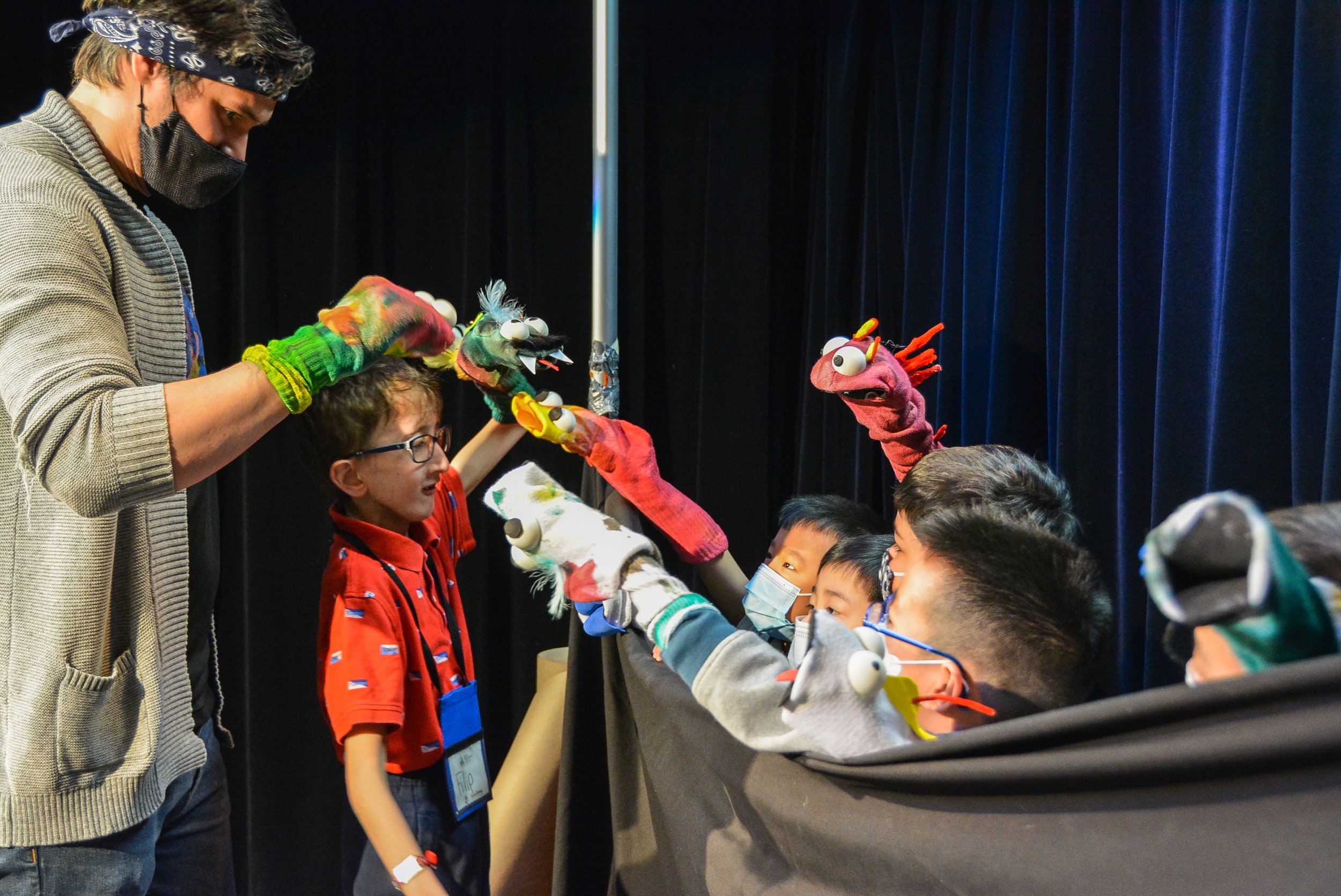  Participants in the Arts Commons Education Program learn how to make puppets from puppeteer Brendan James Boyd, March 2022. Photo by Kiani Evans. 