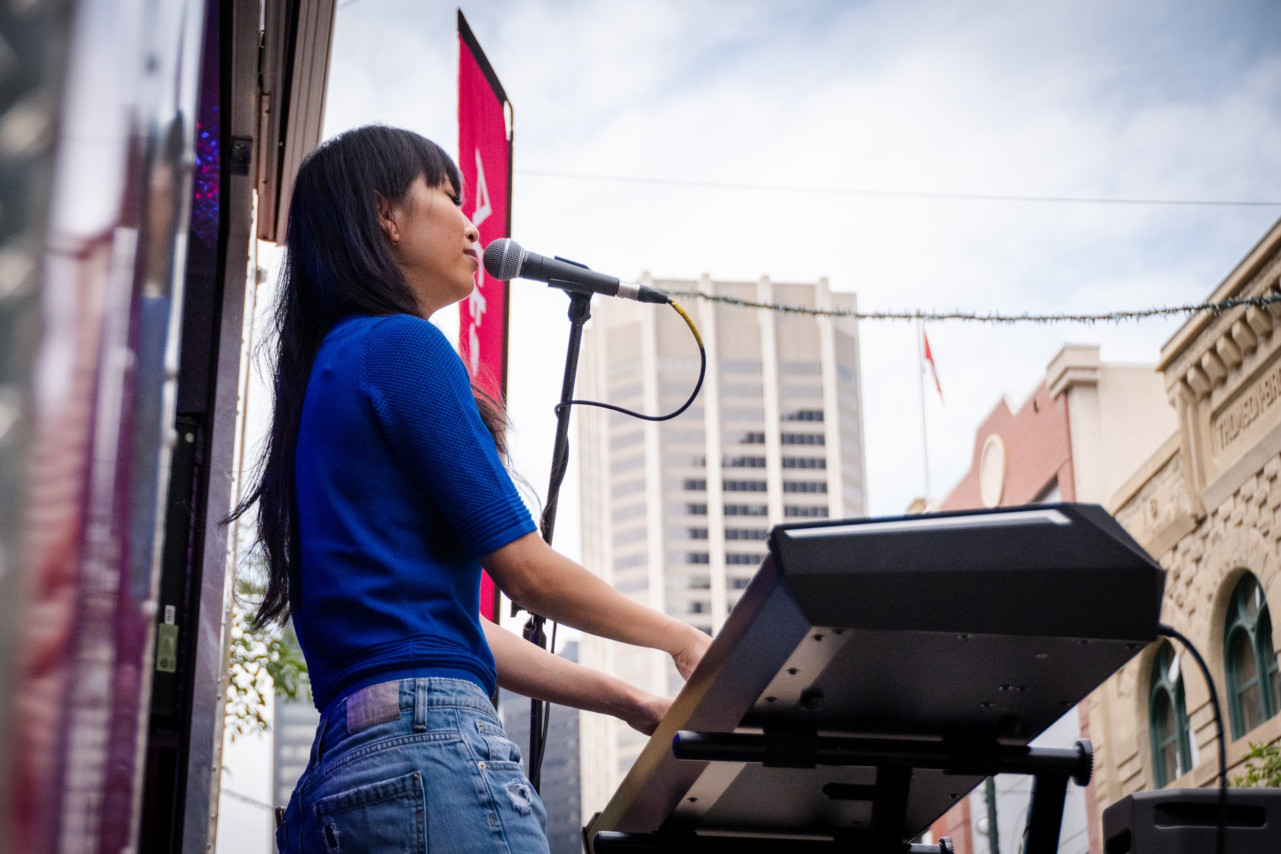  Natalia Chai performs on Stephen Avenue as part of ArtsXpeditions, August 2022. Photo by Kiani Evans. 