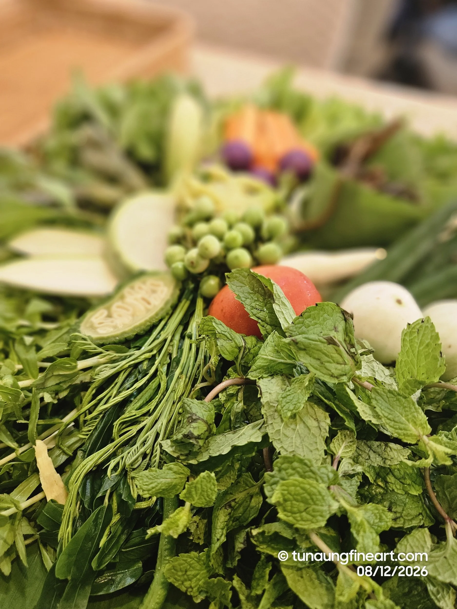 A complimentary side of fresh greens accompany each meal